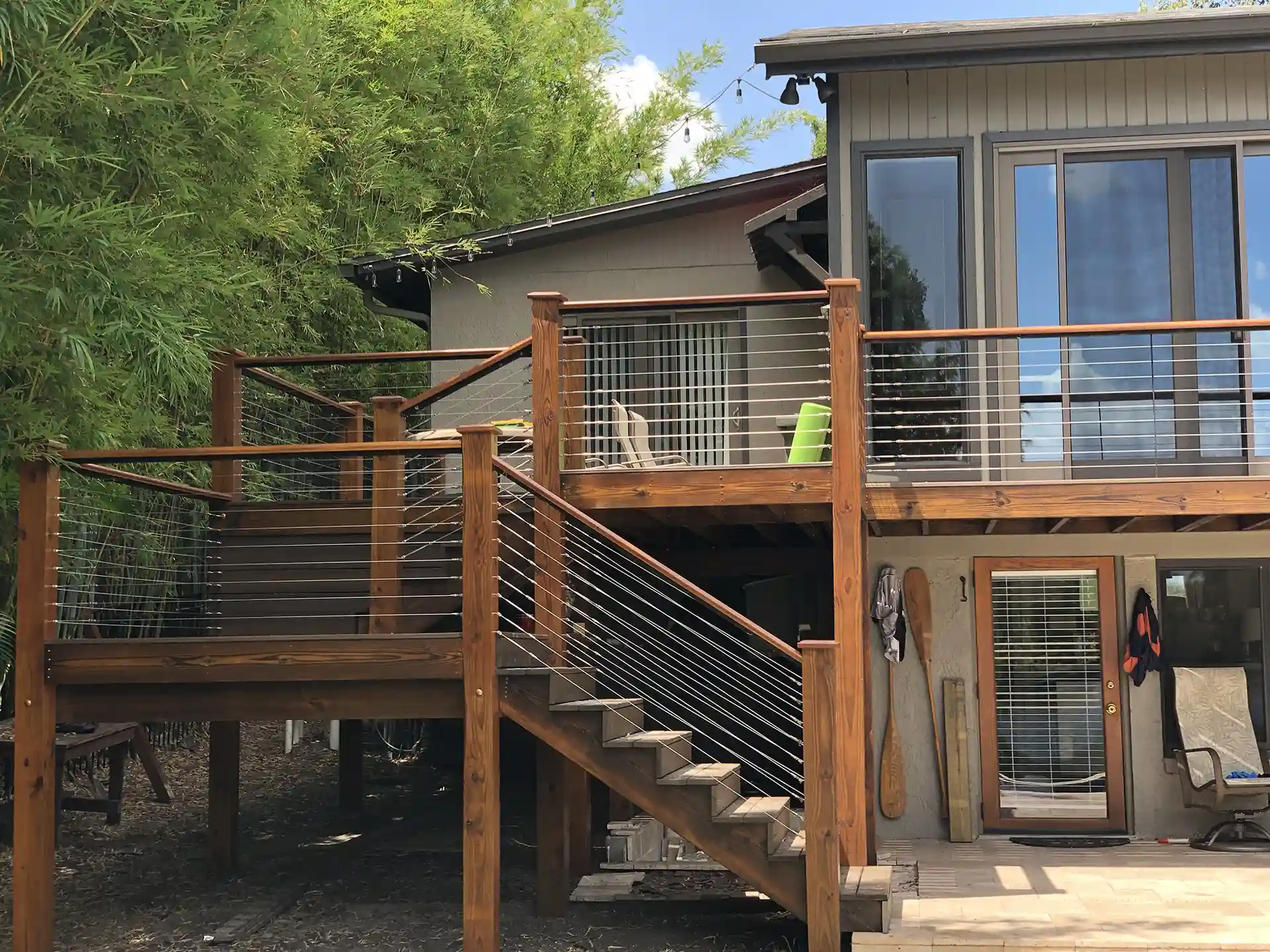 Multi-level deck with stainless steel cable railing - Custom Decks Builder in Orlando Florida