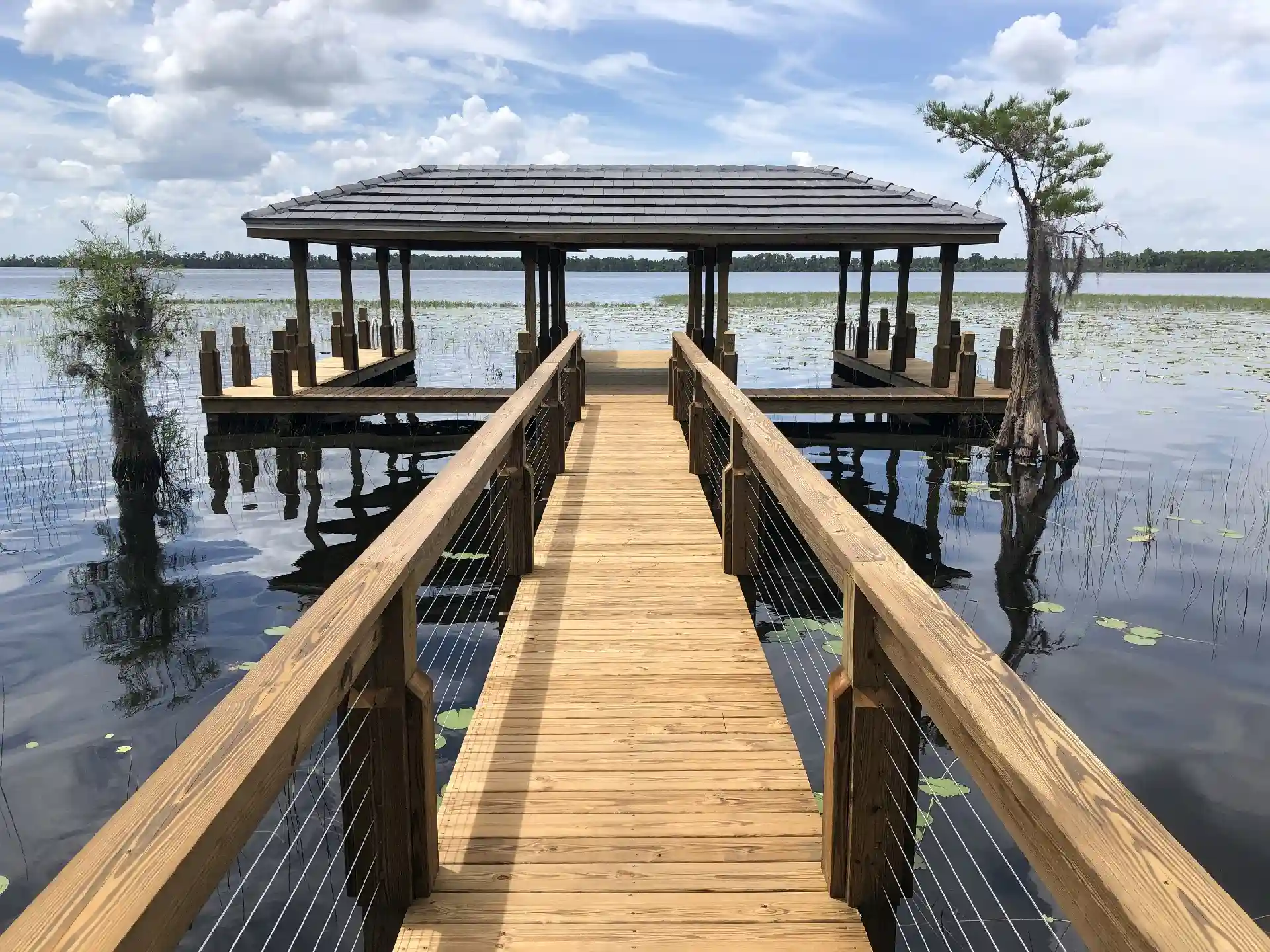 walkway over water to covered boat dock