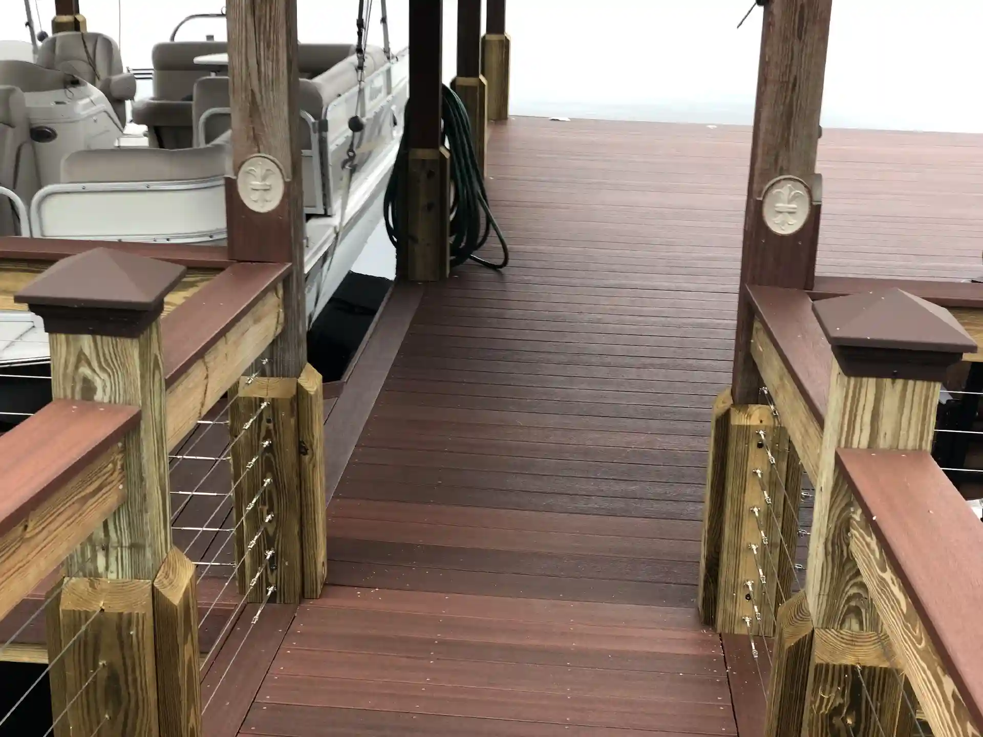 photo of a boat dock with composite decking and cable railing - Trex Decking Costs - Composite Dock Builders near me