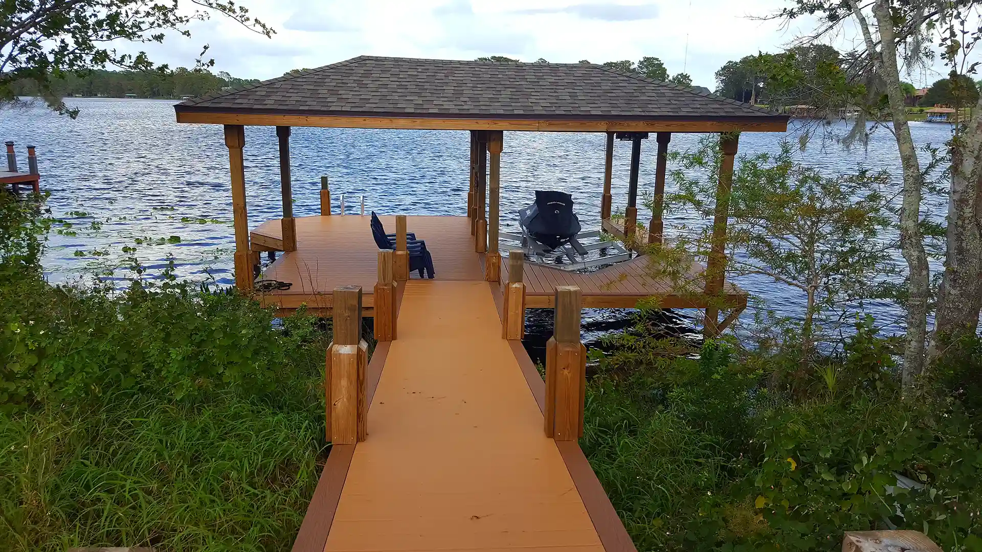 photo of boat dock with boat house
