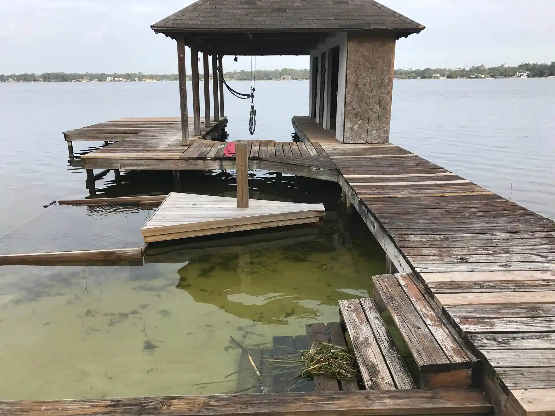 dock walkway, dock, and boathouse that is need of replacement because it was not properly maintained